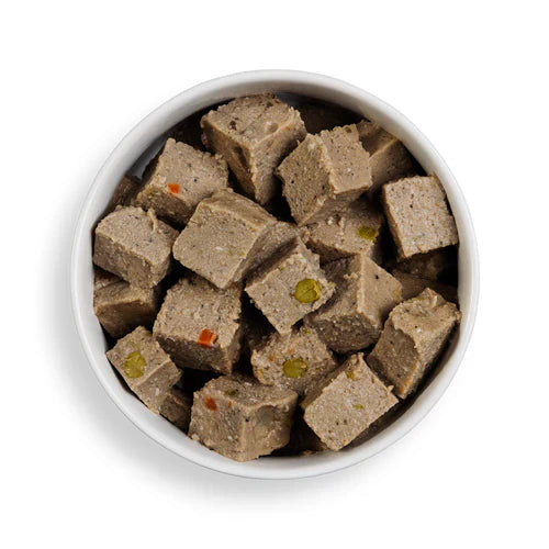 Close-up of Forthglade Salmon Wet Dog Food showing soft flakes of gently steamed salmon and vegetables in a wholesome, grain-free recipe