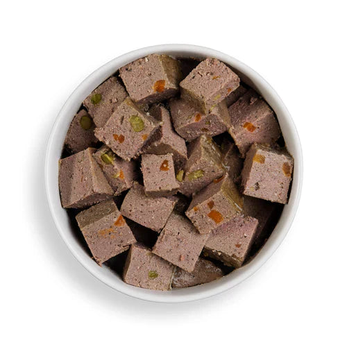 Close-up of Forthglade lamb wet dog food served in a bowl, showcasing the natural, chunky texture and grain-free ingredients.

