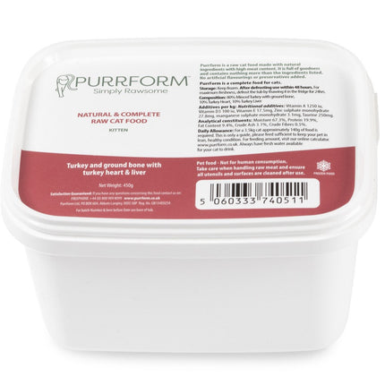 A white plastic container of Purrform cat food with labels detailing the product as a raw food recipe for cats consisting of minced turkey with ground bone, turkey heart, and liver.