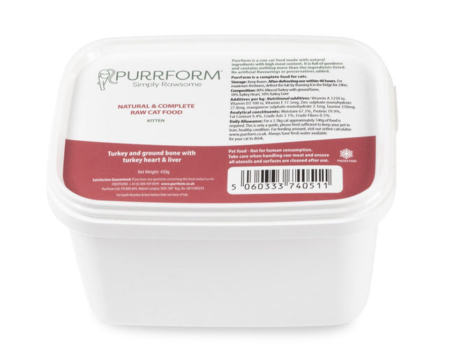 A white plastic container of Purrform cat food with labels detailing the product as a raw food recipe for cats consisting of minced turkey with ground bone, turkey heart, and liver.