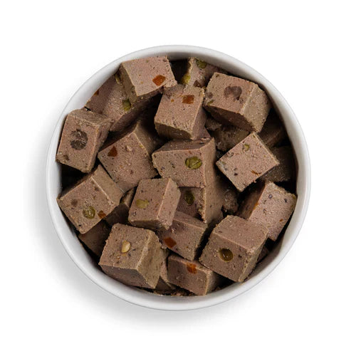 Close-up of Forthglade Beef Wet Dog Food showing meaty chunks and vegetables, gently steamed for taste and nutrition.