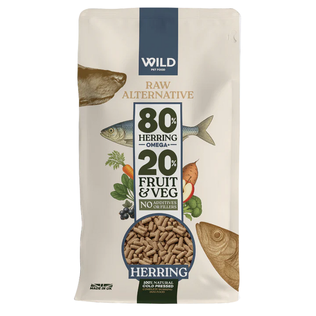 Dog food package with herring and vegetable graphics on a white background